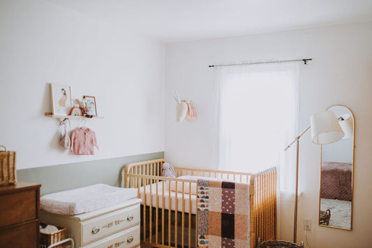 adorable cozy baby girl nursery with wood crib