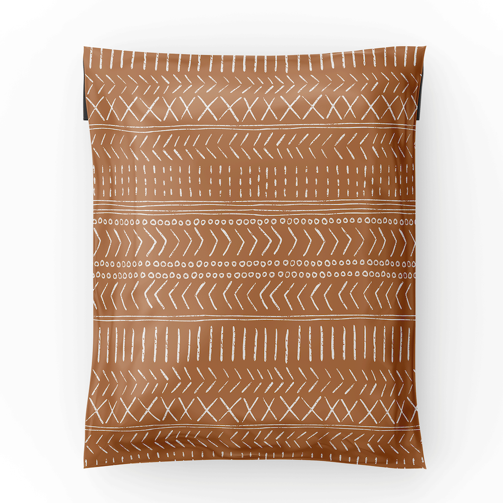 photo of the entire 10x13 boho geo polymailer showing the geometric lines over the brown backdrop