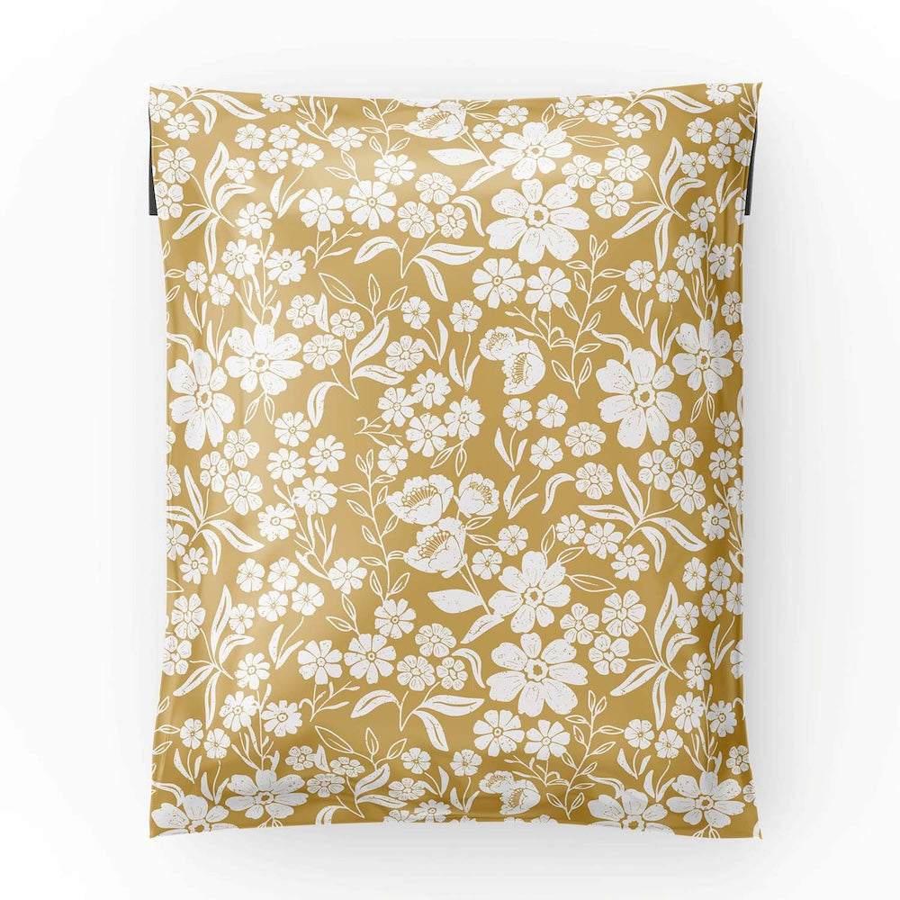 the 10x13 yellow polymailer showing the entire polymailer and the pretty white florals over the yellow background