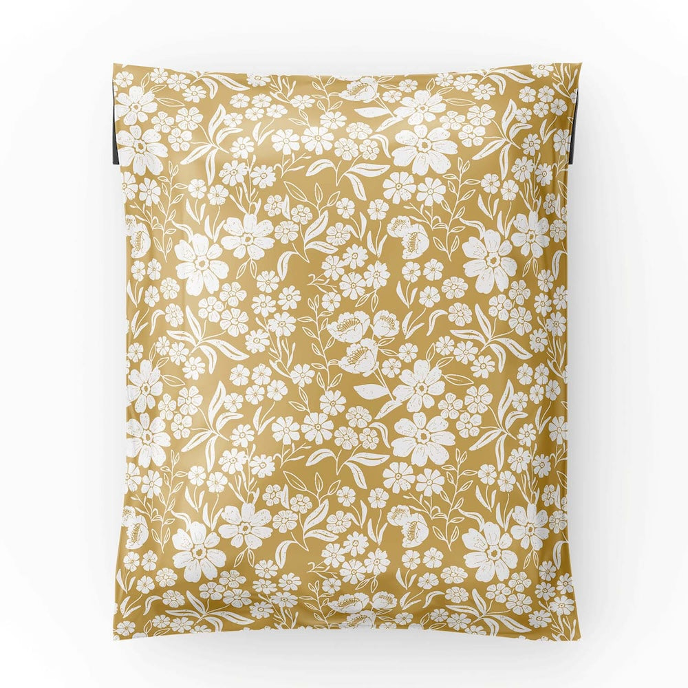 12x15.5 yellow polymailer laid flat showing the white florals over the yellow background