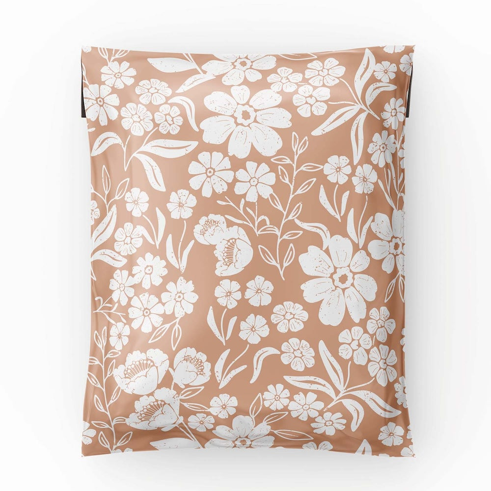 photo of the 6x9 polymailer shipping bag laid flat showing the white flowers in the Dusty Pink Background