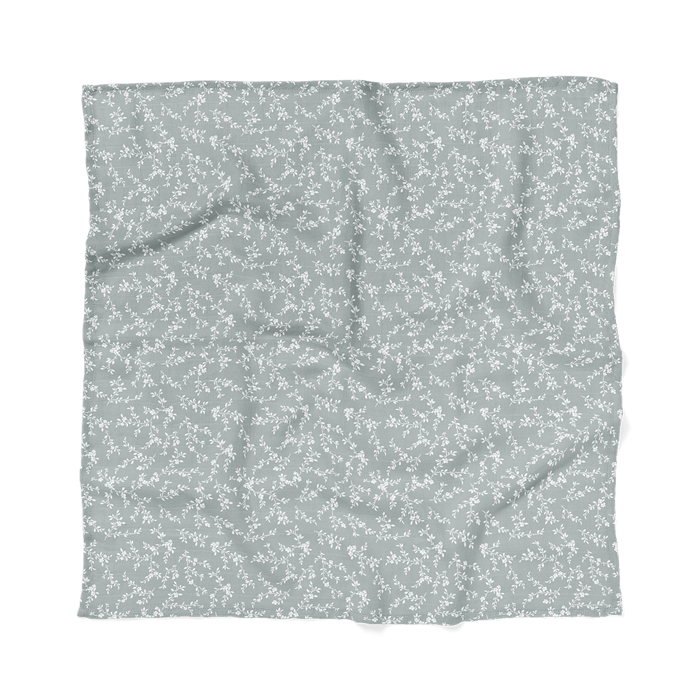 flat photo of mini wander Leafy Sprig swaddle
