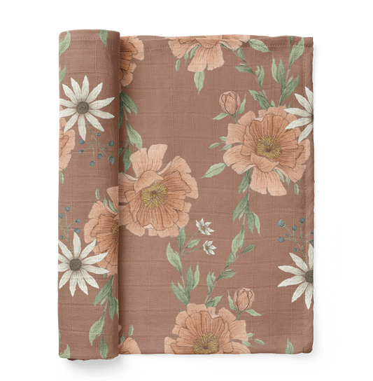 half rolled boho nursery for baby girl showing the peony blooms in clay brown color