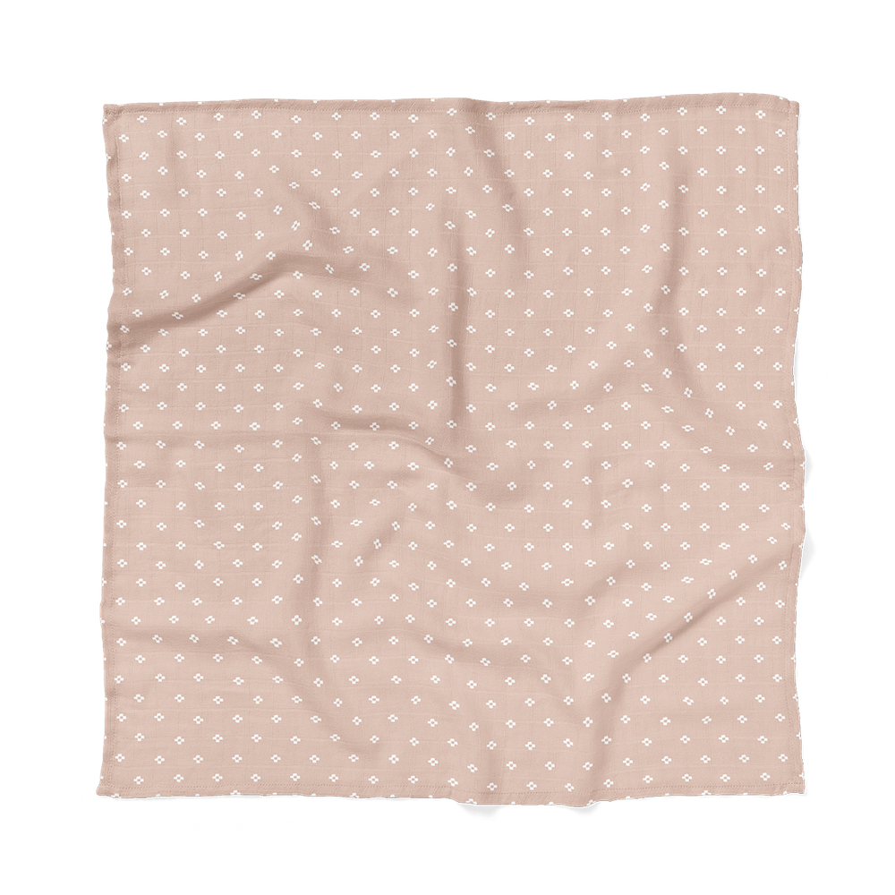 pink baby blanket laid flat showing the boho squares design from Mini Wander