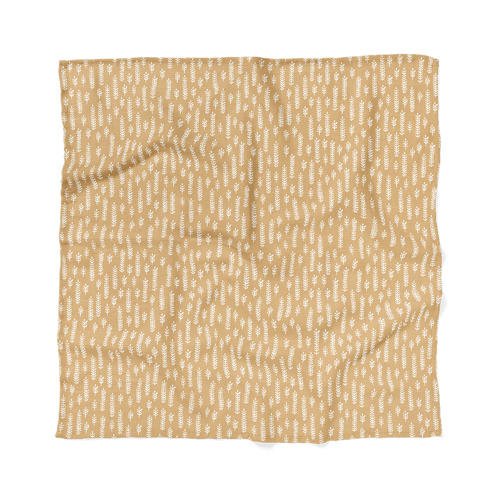 a photo of the cream baby blanket laid flat showing the cream gender neutral baby blanket colors