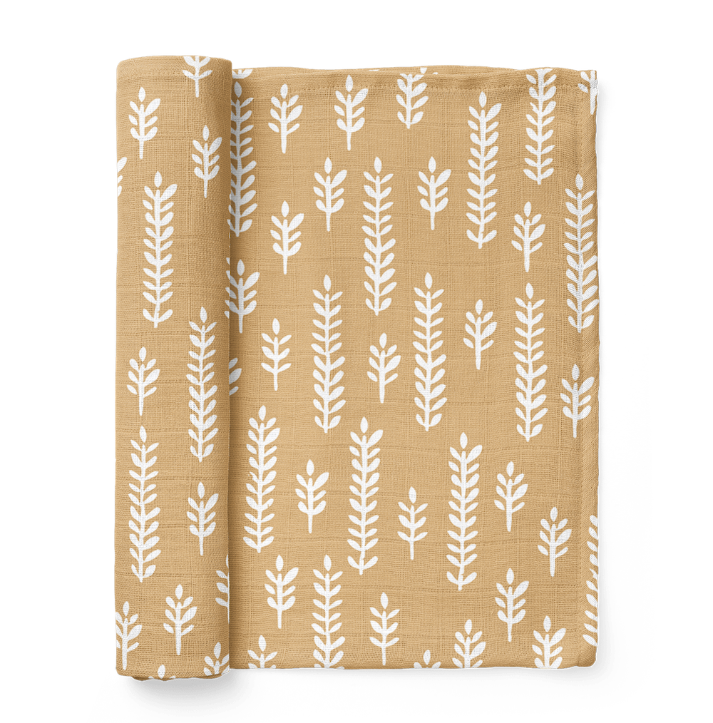 an image of a folded cream baby blanket showing the white wheat patterns