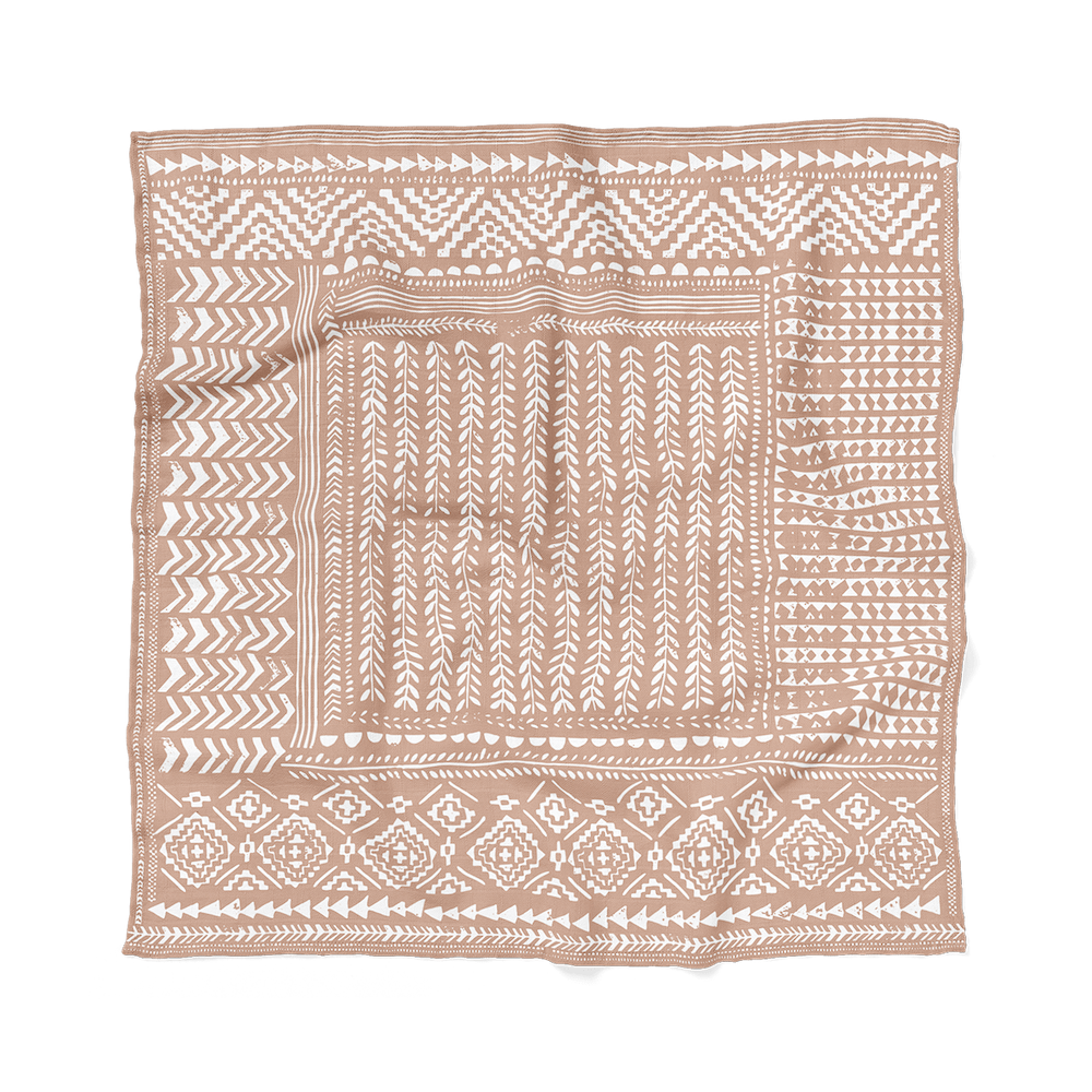 flatlay of the cute baby girl swaddle tapestry which is one of the baby gift set for girls