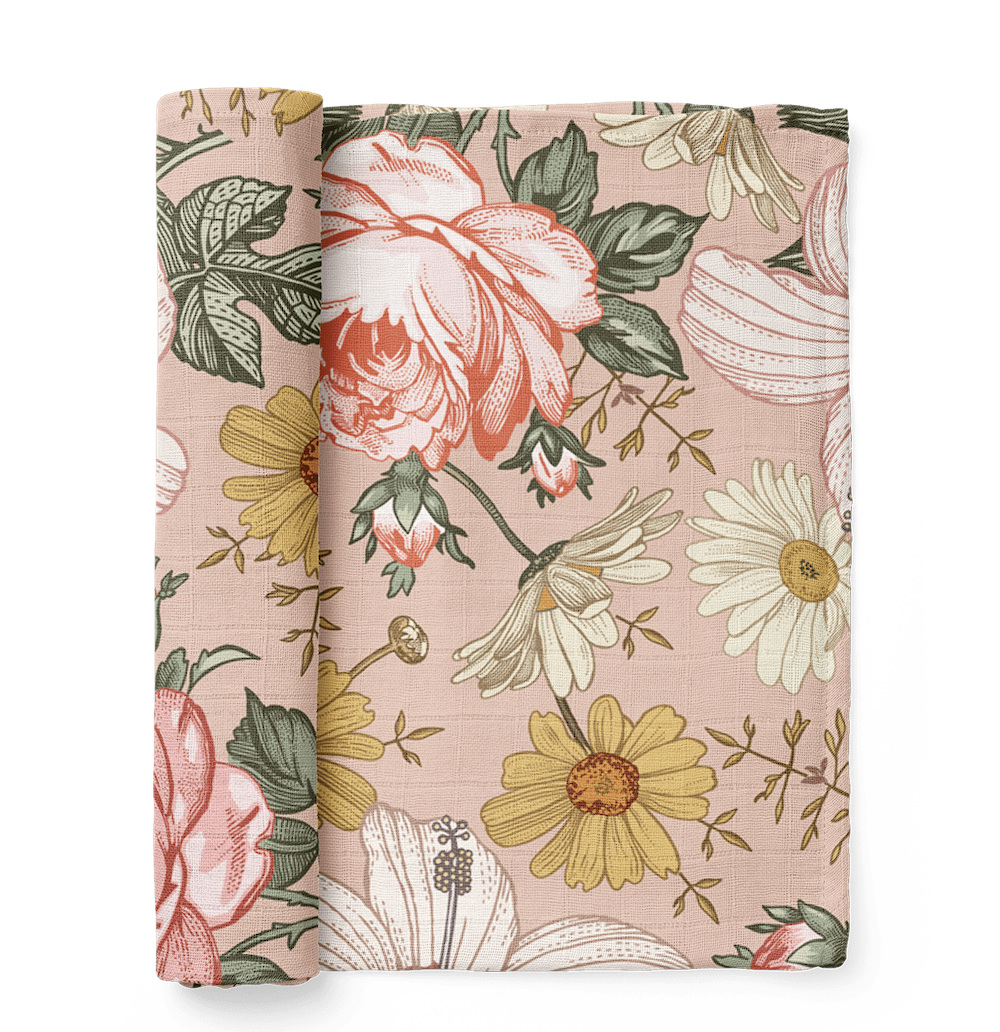 This is a rose pink baby swaddle that has a garden floral design like hibiscus, rose and daisy.