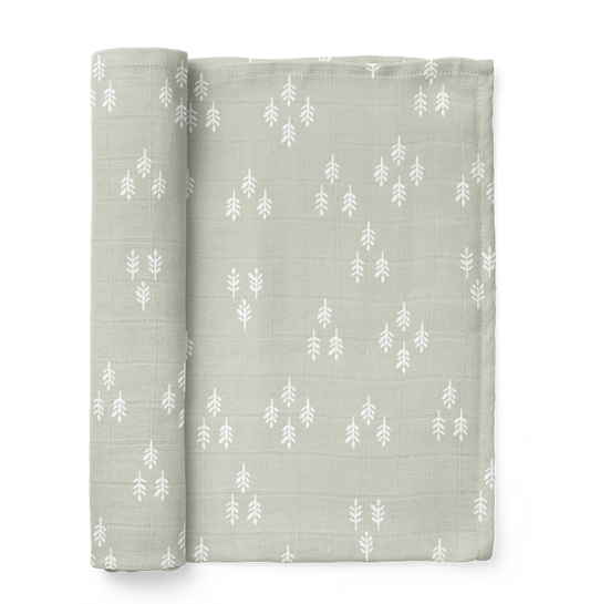 The Mini Wander forest swaddle in the color Gray Wolf and it is the perfect christmas swaddle