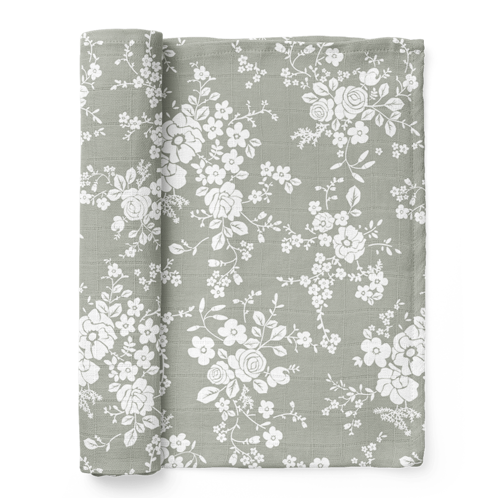 vintage bouquet green flowers swaddle half rolled showing the intricate design of the baby blanket