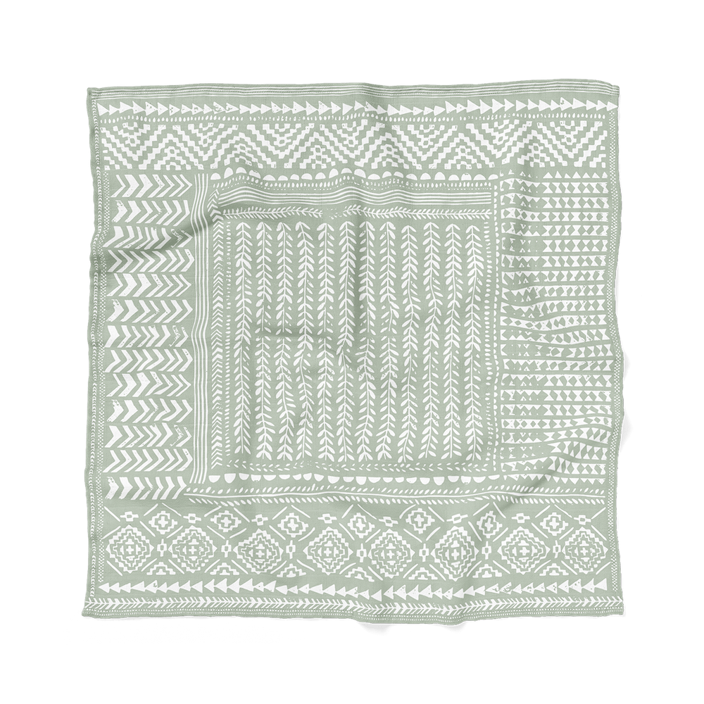 picture of the tapestry boy swaddle laid flat showing the tapestry patterns making it a perfect gift for baby
