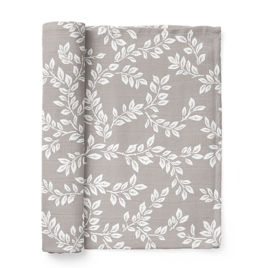 this is a mini wander Leafy Sprig gray swaddle folded like a book