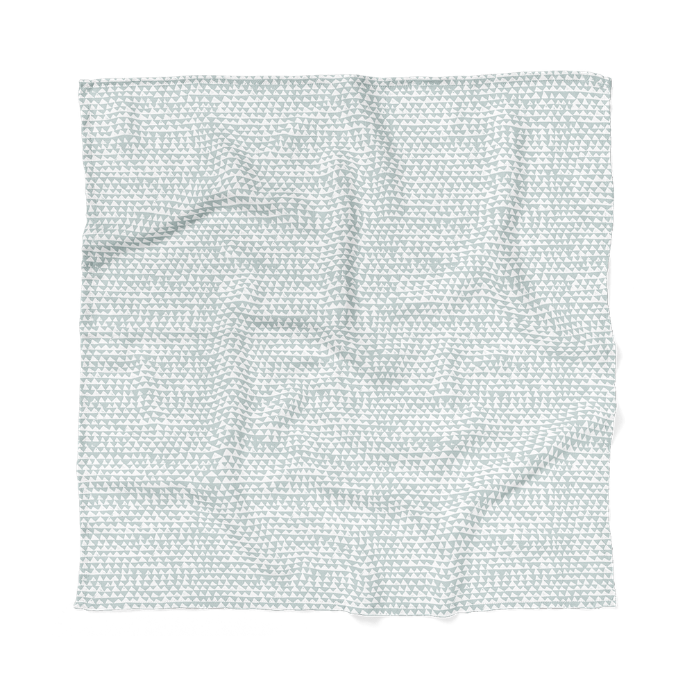 Blue swaddle blanket laid flat showing the checkered triangle swaddle design and print