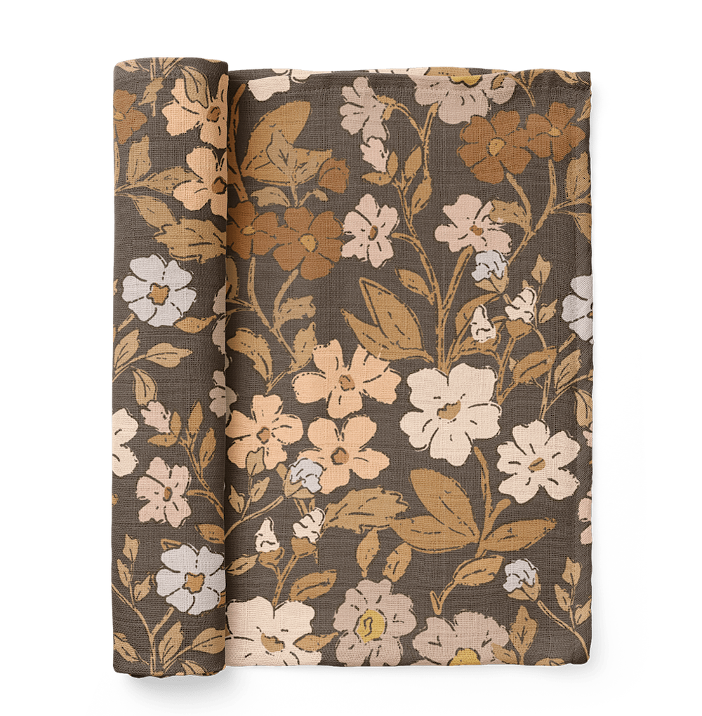 an image of the folded thicket flower swaddle that works perfect as a nursing cover and for any newborn photo outfits