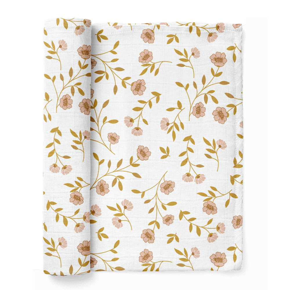 a folded wildflower floral baby blanket folded showing the wildflowers pink print