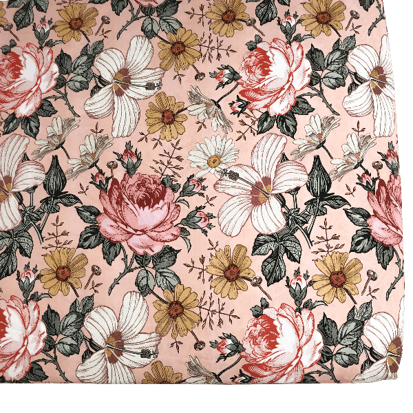 a close up image of most raved favorite nursery decor highlighting the hibiscus, daisies and the roses in a beautiful subtle pink background