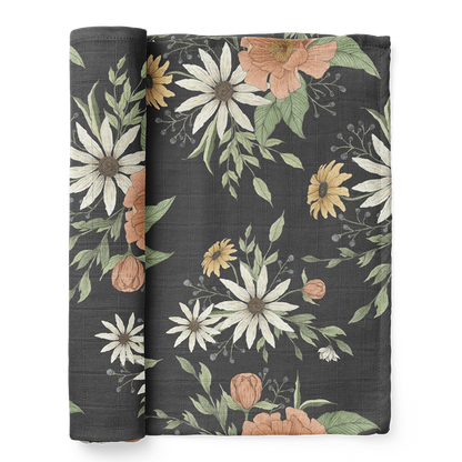 a folded spring blossom charcoal gray cotton swaddle