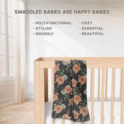 infographic that says swaddled babies are happy babies and all the functions and features of the swaddle blanket with the peony bloom charcoal gray blanket hanging on the wooden crib