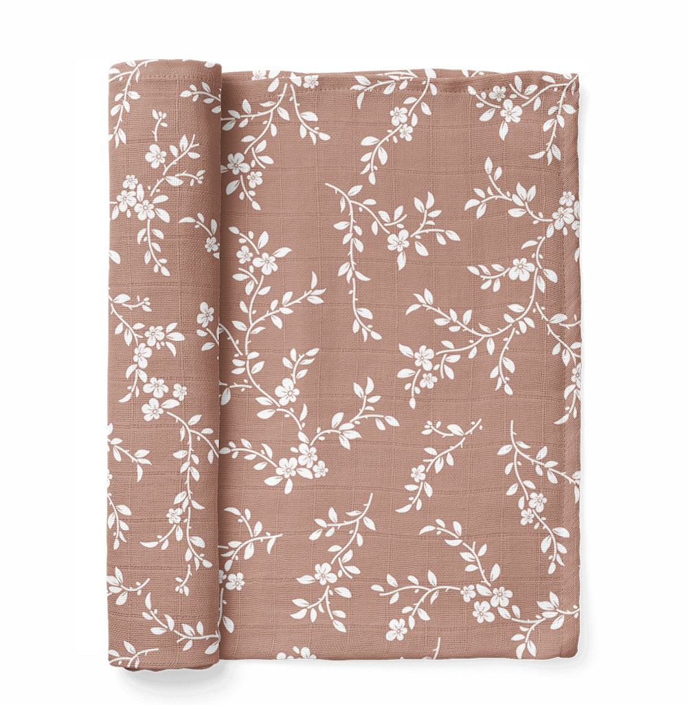 A photo of the mini wander bloom swaddle in sienna color