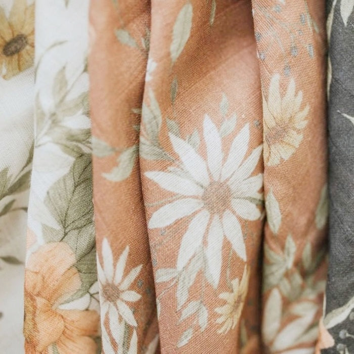 close up photo of the details of the spring blossom swaddle perfect for a boho nursery for baby girl