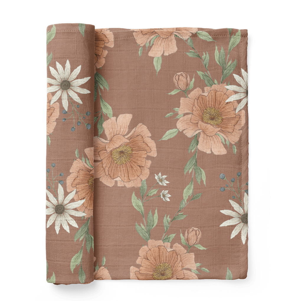 half rolled boho nursery for baby girl showing the peony blooms in clay brown color