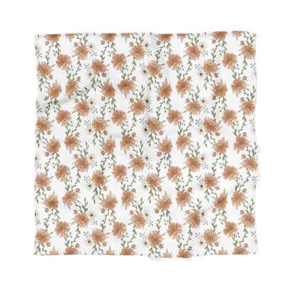 our peony swaddle cotton swaddle blankets laid flat showing the peony blossoms