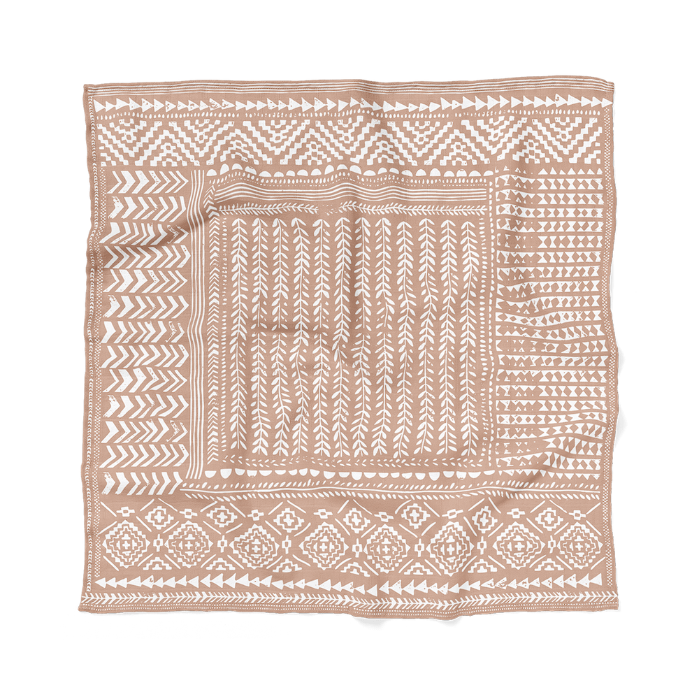 an image of our boho dusty pink swaddle laid flat