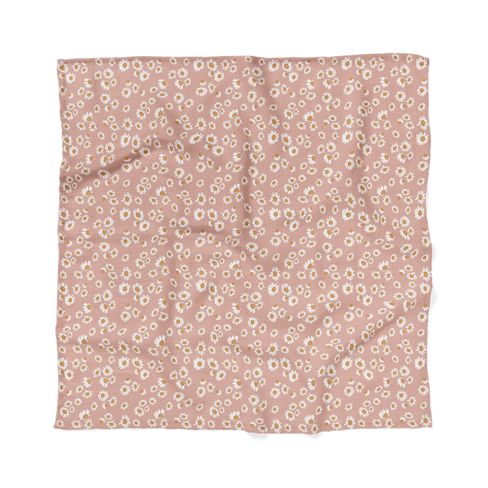 Mini Wander's view of flat soft blush pink color with daisy floral design swaddle.