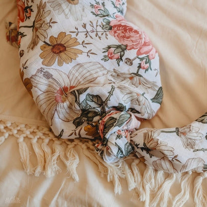 The floral swaddle was tied in a mermaid tail knot on the baby boho themed photoshoot.