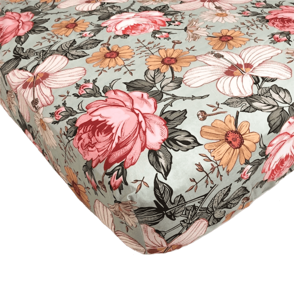 Garden Floral Sea Foam standard cribsheet from Mini Wander. It has a garden floral design with vitage vibes. The floral pattern features large hibiscus flowers, pink rose and daisy.