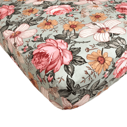 Garden Floral Sea Foam standard cribsheet from Mini Wander. It has a garden floral design with vitage vibes. The floral pattern features large hibiscus flowers, pink rose and daisy.
