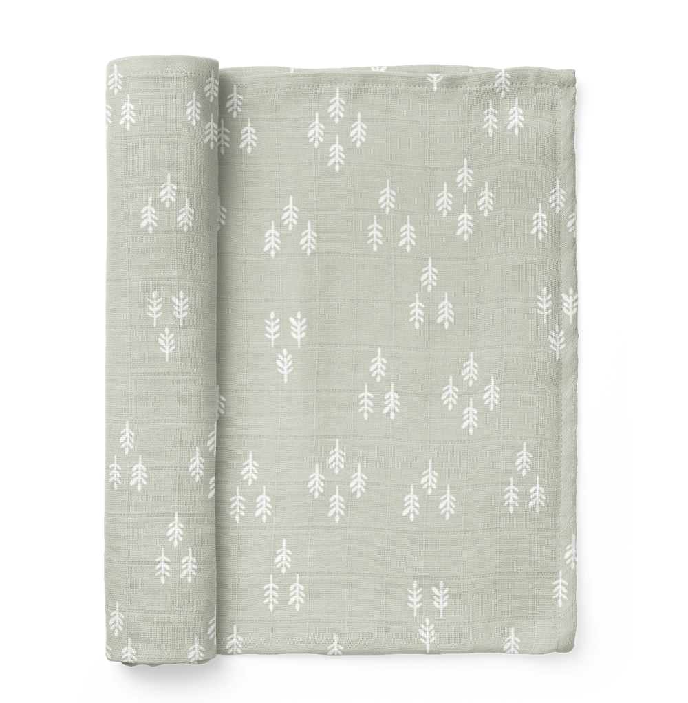 The Mini Wander forest swaddle in the color Gray Wolf and it is the perfect christmas swaddle