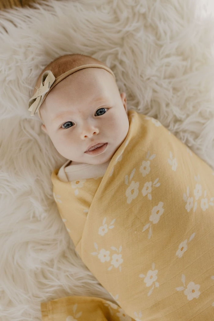 beautiful baby girl wrapped in the best seller newborn swaddle sack