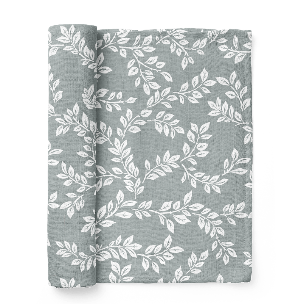 this is a mini wander leafy sprig blue swaddle. Leafy Sprig swaddle boasts an intricate design that reminisces of a sprouting twig.