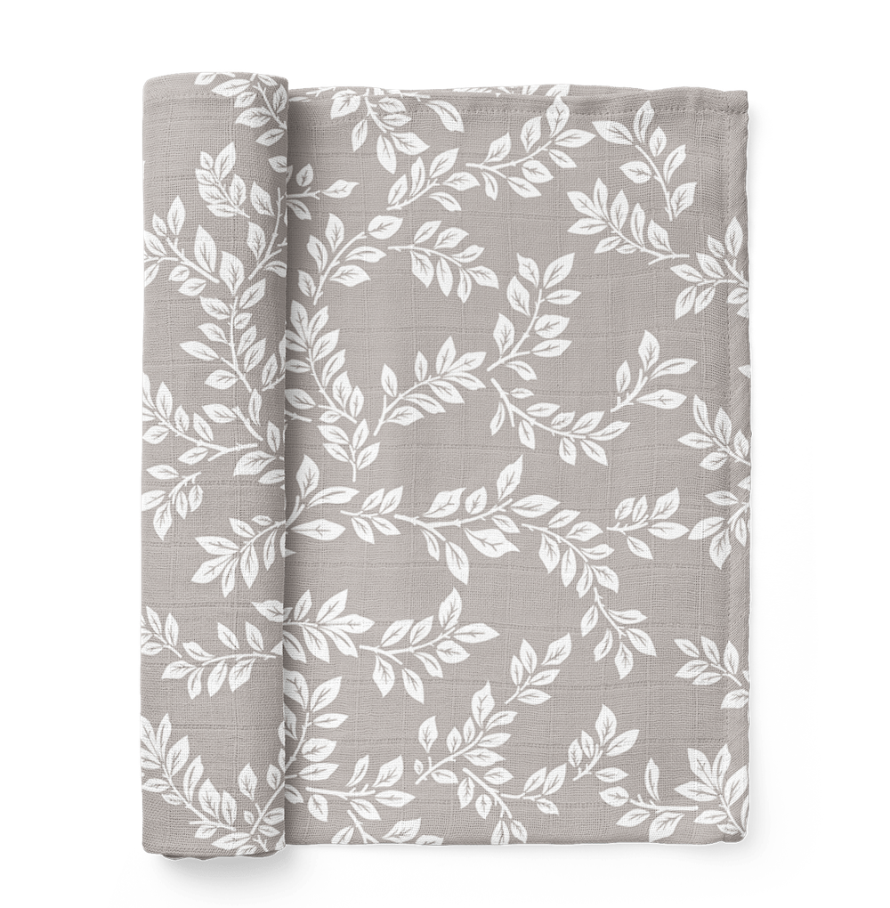 this is a mini wander Leafy Sprig gray swaddle folded like a book