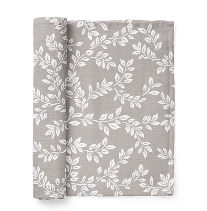 this is a mini wander Leafy Sprig gray swaddle folded like a book