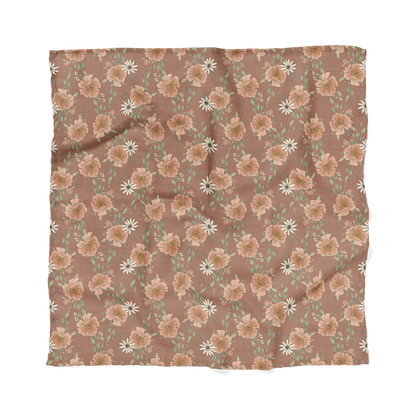 peony blooms clay brown muslin swaddle blanket laid flat