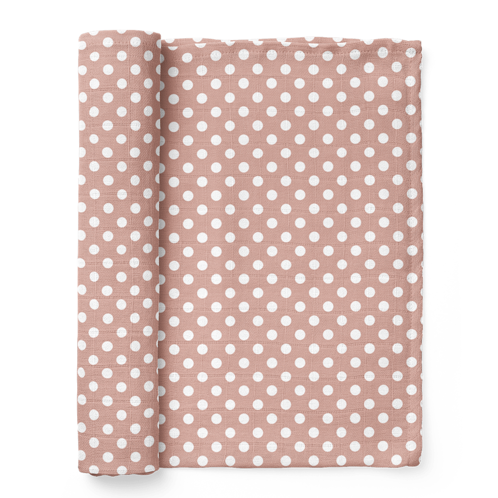 half-rolled polka dot pink swaddle blanket