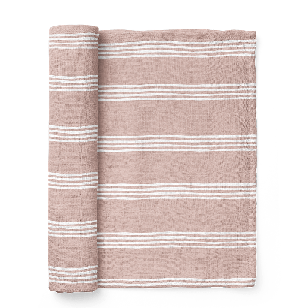 A photo of the classic stripe blankets in a smoky rose mauve color