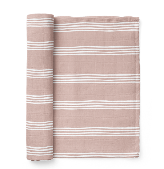 A photo of the classic stripe blankets in a smoky rose mauve color