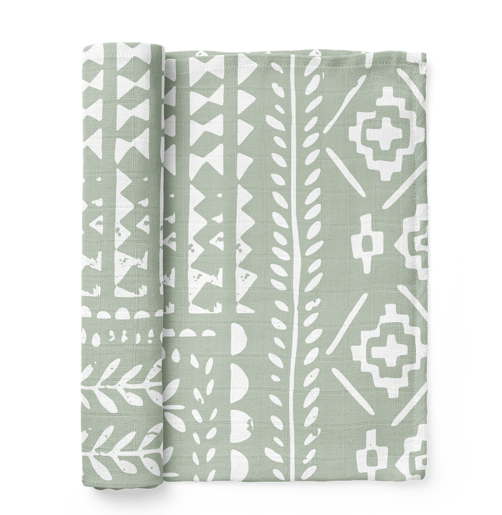 A photo of the Tapestry Green Spruce boy swaddle the perfect gift for baby