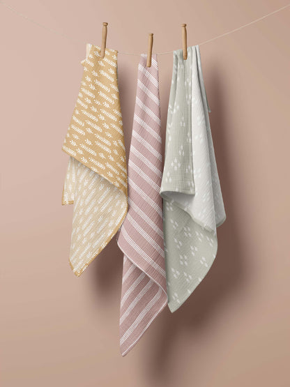  three swaddle baby blankets hanging in the clothesline which comprises the Baby Girl Newborn Set 