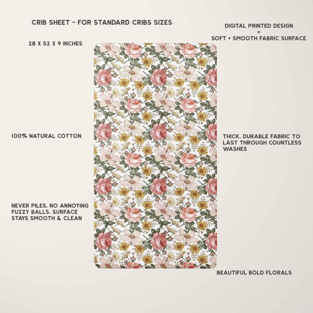 vintage floral crib sheet laid flat showing all the beautiful floral details and information regarding fabric, size and design